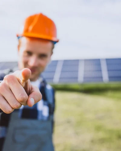 man-worker-firld-by-solar-panels